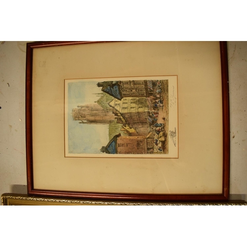 215I - A pair of 20th century framed prints, one of which depicting a gentleman, the other of a street scen... 