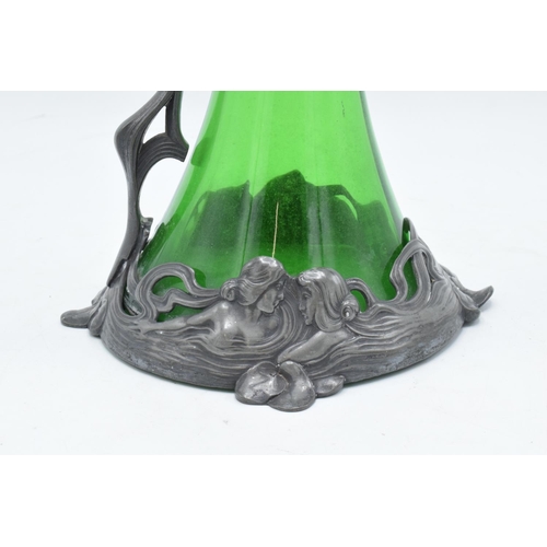219A - A WMF art nouveau pewter claret jug with threaded stopper, tapering green glass body and designed ma... 
