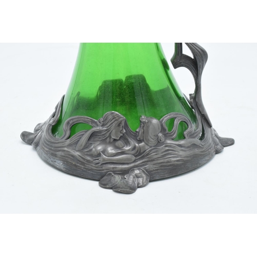 219A - A WMF art nouveau pewter claret jug with threaded stopper, tapering green glass body and designed ma... 