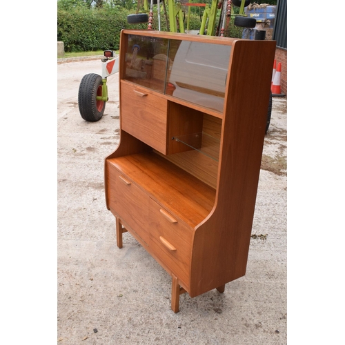 393 - A good mid century teak or similar wood cabinet / sideboard with glass sliding doors and drawers etc... 