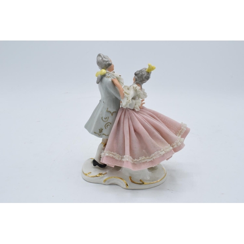 95K - A late 19th / early 20th century Dresden lace figure of a couple dancing with the 'N' mark below a 5... 