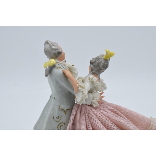 95K - A late 19th / early 20th century Dresden lace figure of a couple dancing with the 'N' mark below a 5... 