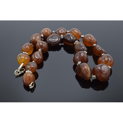 215M - Large & heavy string of semi precious gemstone agate (or similar ) beads.