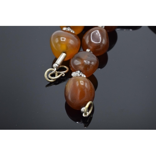 215M - Large & heavy string of semi precious gemstone agate (or similar ) beads.