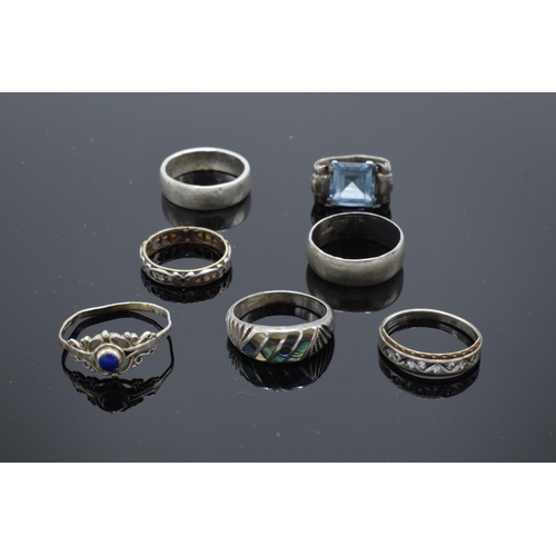 215N - Seven assorted silver rings, some gem or paste set, two mishapen (7)