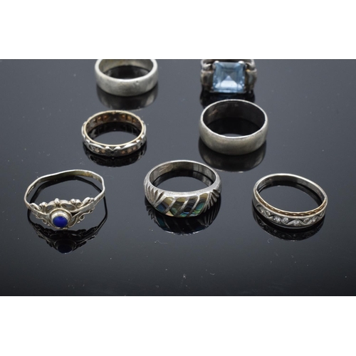 215N - Seven assorted silver rings, some gem or paste set, two mishapen (7)