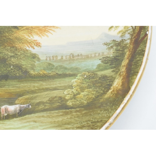 75A - Victorian Staffordshire hand painted wall plaque, titled to reverse ‘ A pastoral Landscape’, and ind... 