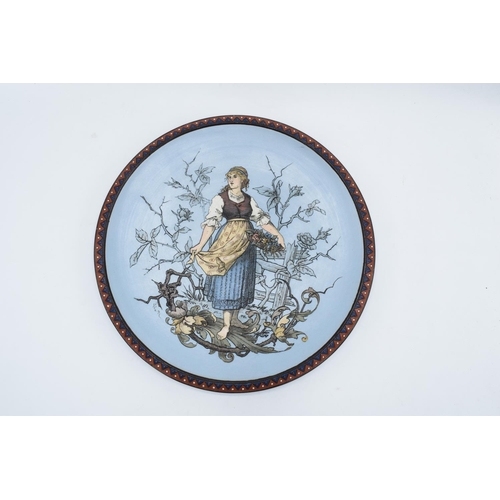 65 - Late 19th century Mettlach (Villeroy and Boch) wall charger after C. Warth decorated with a lady hol... 