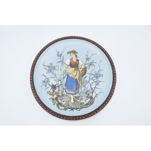 66 - Late 19th century Mettlach (Villeroy and Boch) wall charger after C. Warth decorated with a lady hol... 