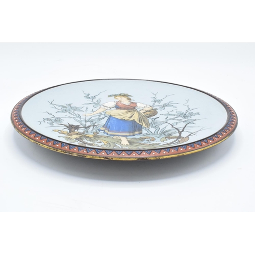 66 - Late 19th century Mettlach (Villeroy and Boch) wall charger after C. Warth decorated with a lady hol... 