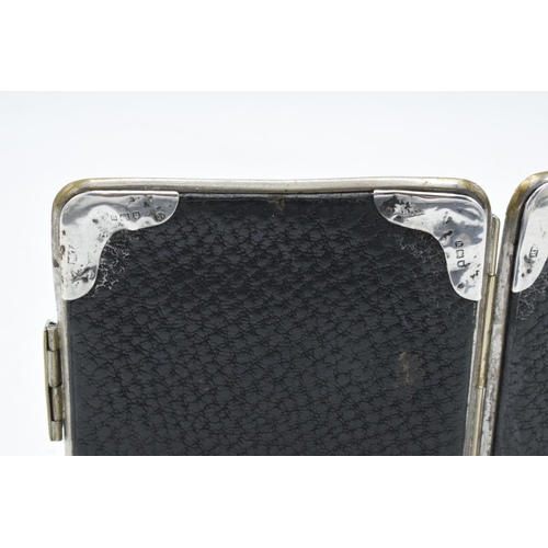 300 - A leather Gent's card case with each corner having silver mounts (London 1903).