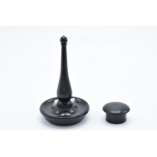 307 - An ebony ring stand with a silver mount (London) together with an ebony circular pill box (2). 11cm ... 