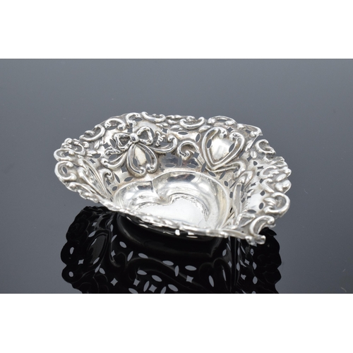 310 - An ornate silver sweet dish/ small tray Birmingham 1900. 9cm by 7cm. 11.9 grams.