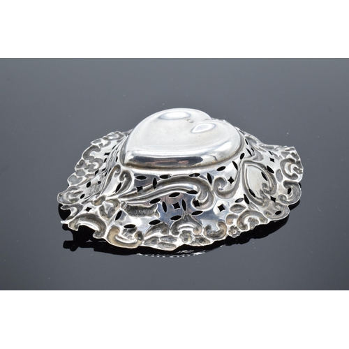 310 - An ornate silver sweet dish/ small tray Birmingham 1900. 9cm by 7cm. 11.9 grams.