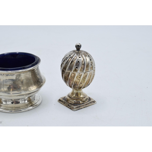 320 - A collection of hallmarked silver items to include acorn shaped cruet shakers (42.3 grams of silver)... 