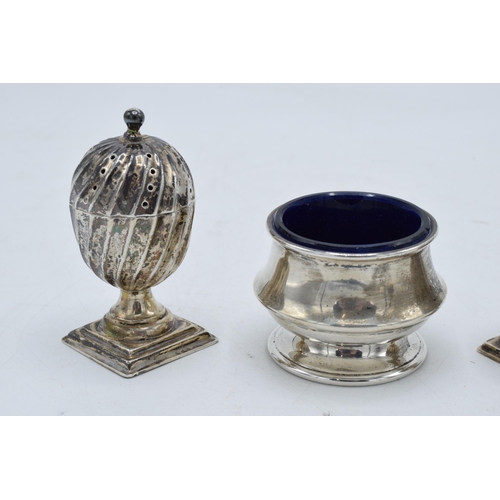 320 - A collection of hallmarked silver items to include acorn shaped cruet shakers (42.3 grams of silver)... 