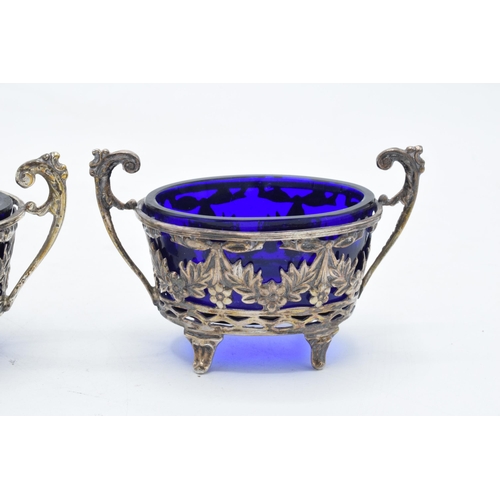 321 - A pair of silver table salts with associated blue glass liners (2). Chester 1894. 101.3 grams of sil... 