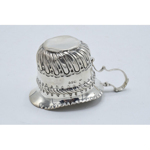 333 - An ornate silver cream jug / sauce jug. London 1890.  53.7 grams. In good condition with some dents ... 