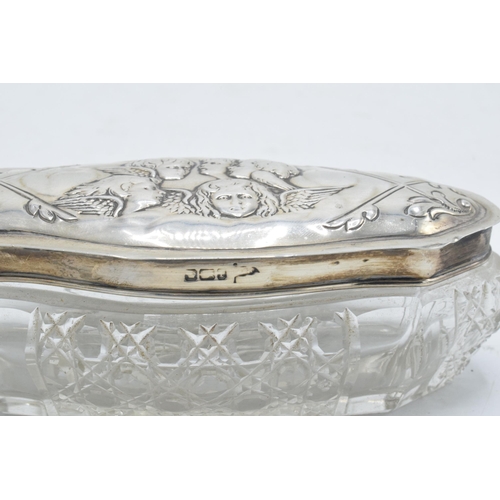 343 - Silver topped dressing table jar with cherub decoration
silver in good used condition, Sheffield hal... 