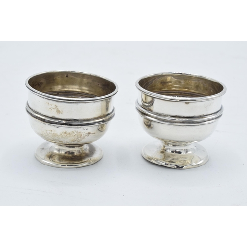 345 - A pair of silver egg cups / table salts hallmarked for Chester 1902 (2). 54.8 grams. In good conditi... 