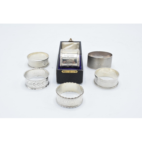 348 - Group of 6 silver napkin rings. All hallmarked, 4 rings with engraved initials, 1 has a case. weight... 