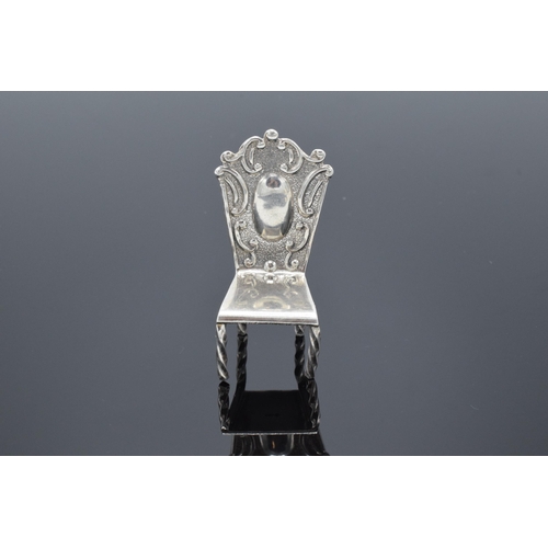 363 - Silver (925) miniature model of a hall chair. 10.8 grams. 5cm tall.