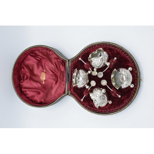 371 - A quality cased set of 4 silver plate table salts with matching spoons in a fitted case. J H Potter ... 