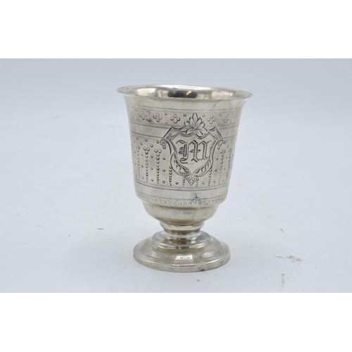 387 - Continental silver footed beaker with engraved decoration. 9cm tall. 63.3 grams.