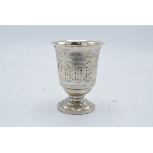 387 - Continental silver footed beaker with engraved decoration. 9cm tall. 63.3 grams.