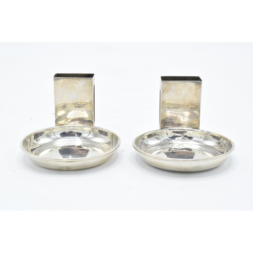 389 - A pair of Asprey's silver match box holders and ashtrays. London 1925. 59.7 grams gross weight. 4.5c... 