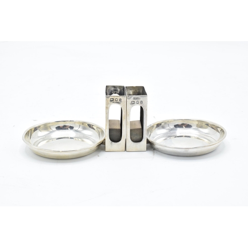 389 - A pair of Asprey's silver match box holders and ashtrays. London 1925. 59.7 grams gross weight. 4.5c... 