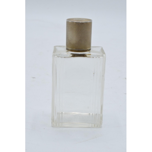 395 - A silver topped French glass scent bottle. 9cm tall.