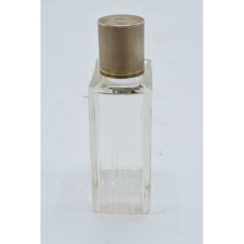 395 - A silver topped French glass scent bottle. 9cm tall.