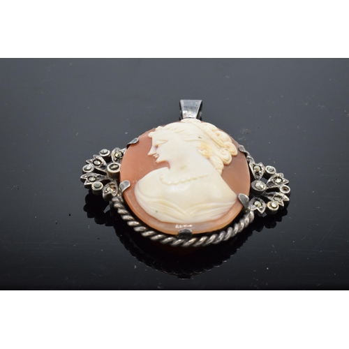 553 - Sterling silver and marcasite cameo pendant. 5cm tall.