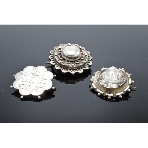 554 - A collection of Victorian silver brooches to include a hallmarked example for Birmingham 1888 (3). 1... 