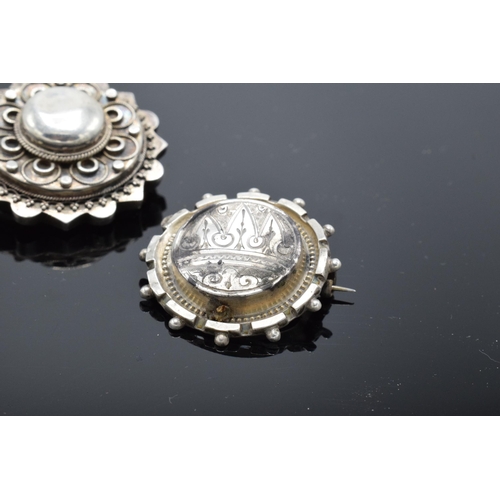 554 - A collection of Victorian silver brooches to include a hallmarked example for Birmingham 1888 (3). 1... 