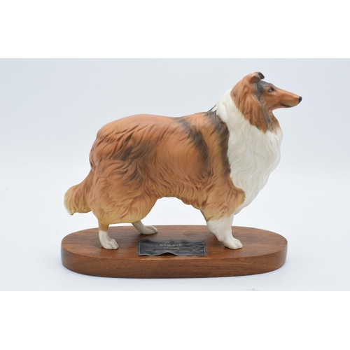 148 - Beswick Connoisseur model of Rough Collie mounted on a wooden base. 20cm tall. In good condition wit... 