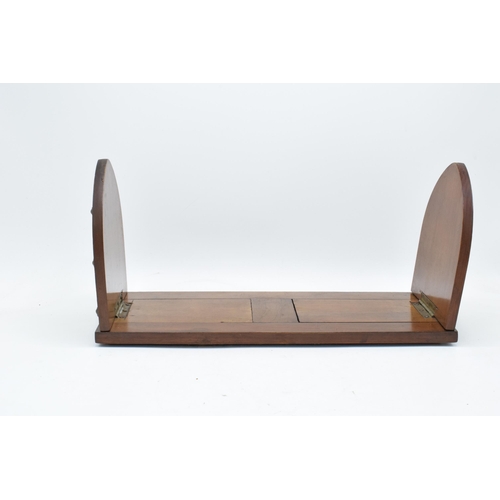 153 - An early 20th century wooden and brass adjustable bookshelf. 54cm at longest. In good condition.