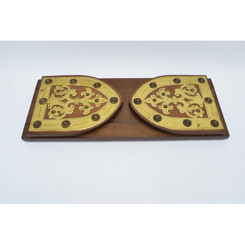 153 - An early 20th century wooden and brass adjustable bookshelf. 54cm at longest. In good condition.