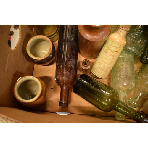 31 - A mixed collection of vintage items to include stoneware jars and advertising glass bottles to inclu... 