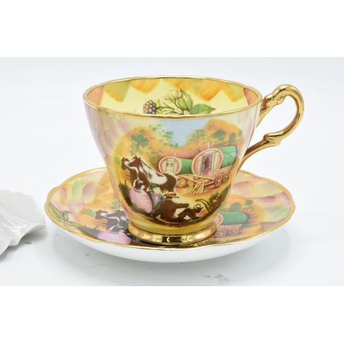 62 - A Baron China cup and saucer in the Atchin Tan design depiciting Romany scenes together with a Frank... 