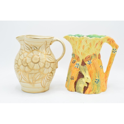 63 - A Burleigh Ware jug 'The Harvest Rabbit' together with a Hancocks Ivory Ware jug (2). 19cm tallest. ... 