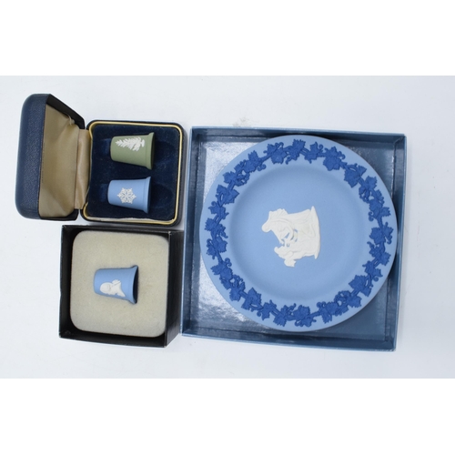 77 - A collection of Wedgwood Jasperware to include a boxed green and blue thimble set, a Josiah Wedgwood... 