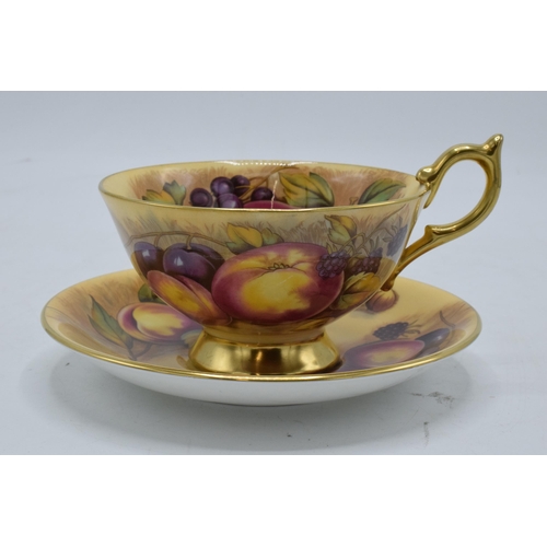 78 - Aynsley cup and saucer in the Orchard Gold design (2). Both pieces are signed by N. Brunt. In good c... 