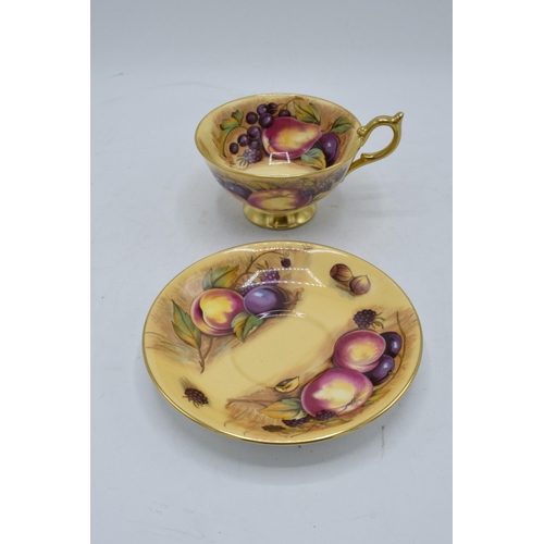 78 - Aynsley cup and saucer in the Orchard Gold design (2). Both pieces are signed by N. Brunt. In good c... 