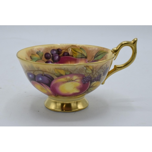 78 - Aynsley cup and saucer in the Orchard Gold design (2). Both pieces are signed by N. Brunt. In good c... 