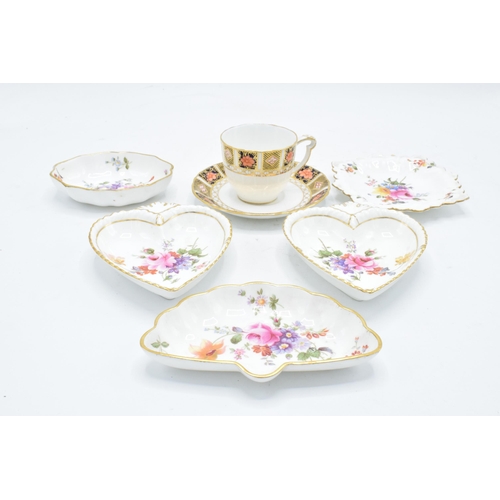 83 - A collection of Royal Crown Derby items to include an Imari cup and saucer, Derby posies pin trays e... 