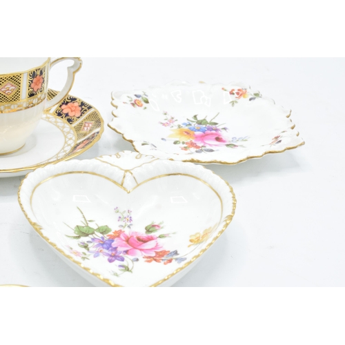 83 - A collection of Royal Crown Derby items to include an Imari cup and saucer, Derby posies pin trays e... 