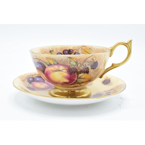 85 - Aynsley cup and saucer in the Orchard Gold design (2). In good condition with no obvious damage or r... 