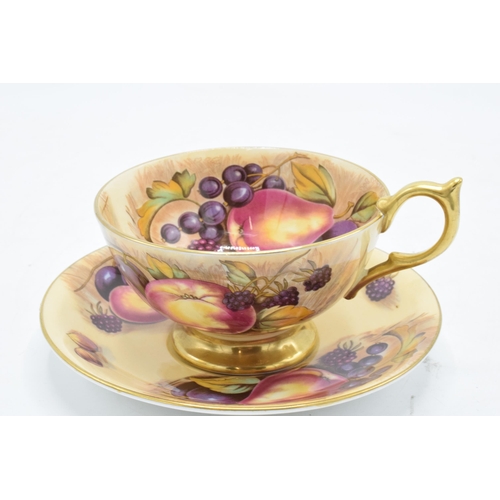 85 - Aynsley cup and saucer in the Orchard Gold design (2). In good condition with no obvious damage or r... 